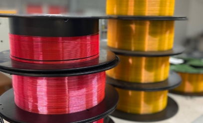 Bobines de fibres optiques polymères produites par Apollinaire Composites et Technologies